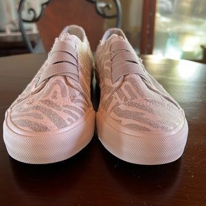 Zebra print slip on shoes